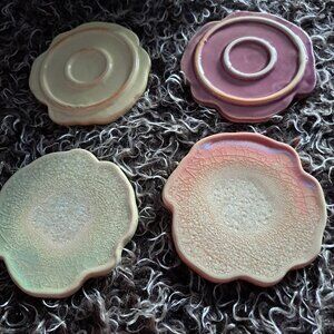 Francesca 6 sites These appear to be handmade ceramic coasters with an organic,